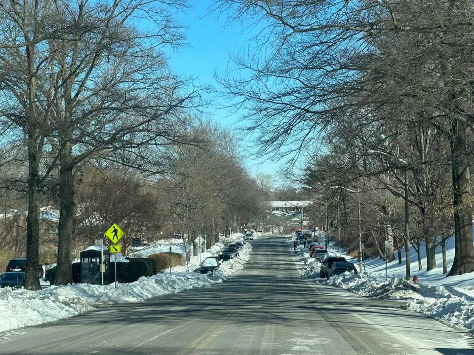 Snow blocks in cars parked along Pimmit Drive in Idylwood (staff photo by Angela Woolsey)