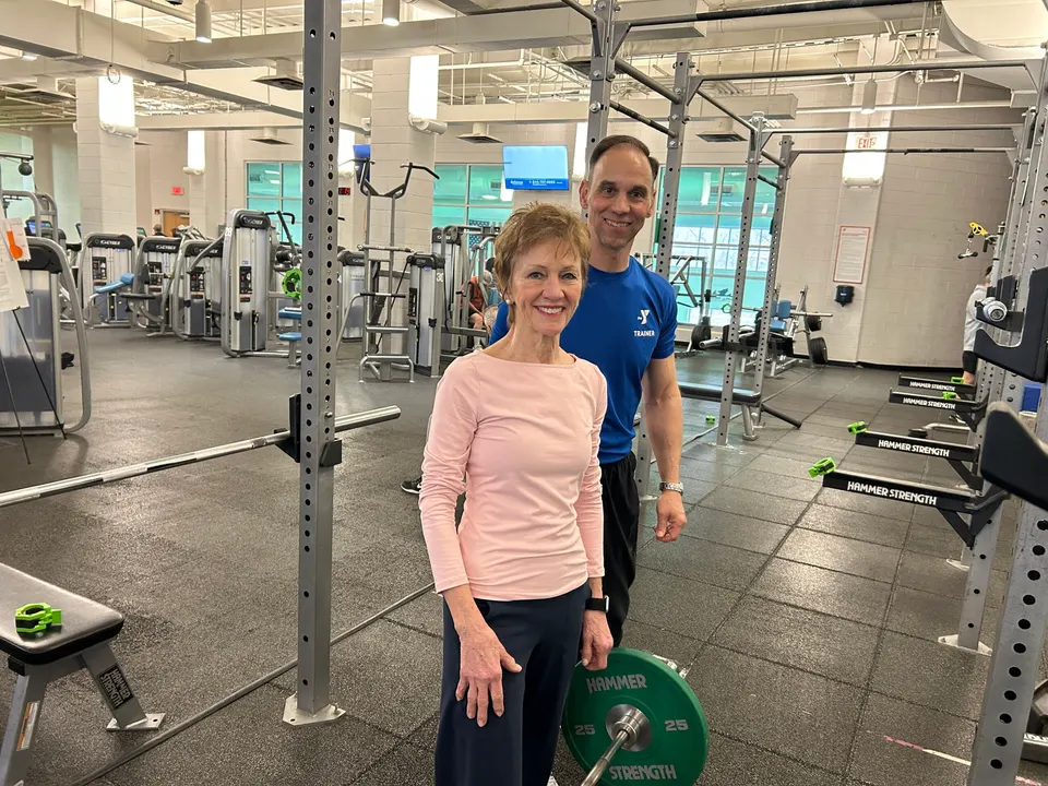 Becky Lane alongside Pete Gallelli, the head trainer at the YMCA in Reston.