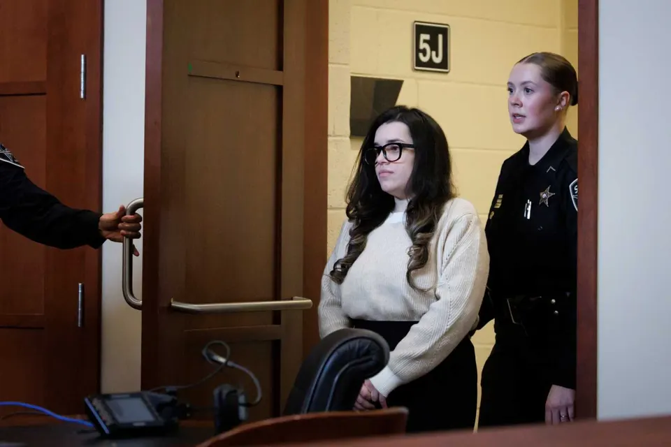 Juliana Peres Magalhães is escorted into the courtroom before continuing her testimony, during the double murder trial for Brendan Banfield in Fairfax County Circuit Court,...