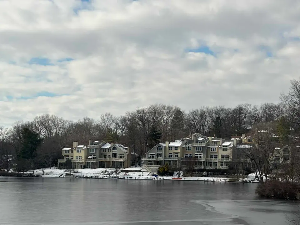 Homes along Lake Audubon in Reston with snow on the ground (staff photo by Angela Woolsey)