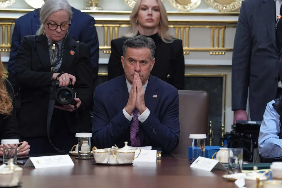 CIA Director John Ratcliffe, seated at center, and White House press secretary Karoline Leavitt, standing in back, listen during a cabinet meeting at the White House, Thursday,...