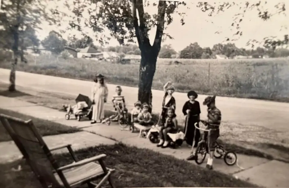 "....We also organized parades through the neighborhood. We decorated our bikes with crepe paper streamers through the wheel spokes and organized the paraders." Photo by the...