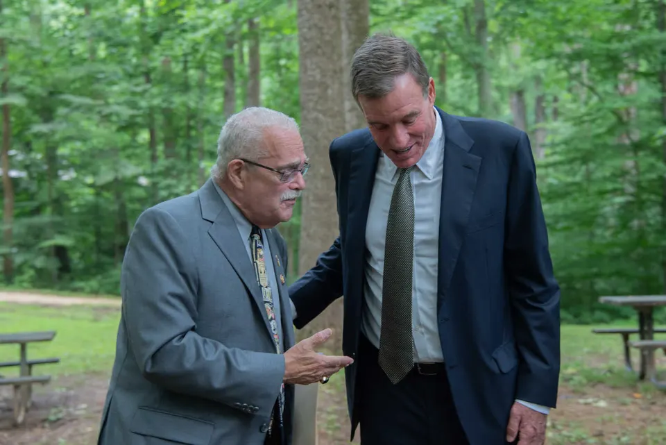 Virginia Sen. Mark Warner (right) talking with late Congressman Gerry Connolly in July 2022 (courtesy Office of Senator Mark Warner)