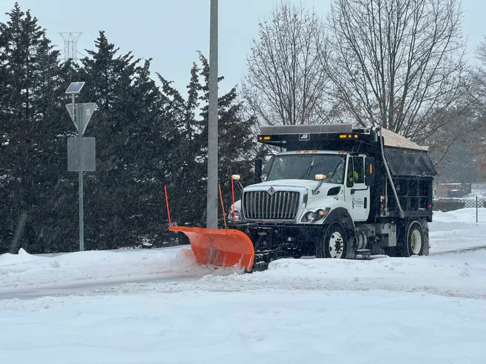 Town of Vienna snow plow clearing road during Winter Storm Fern (staff photo by Angela Woolsey)