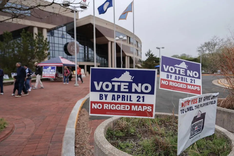 Voters walk outside the Fairfax County Government Center during early voting for the Virginia redistricting referendum, Friday, April 3, 2026, in Fairfax, Va. (AP Photo/Julia...