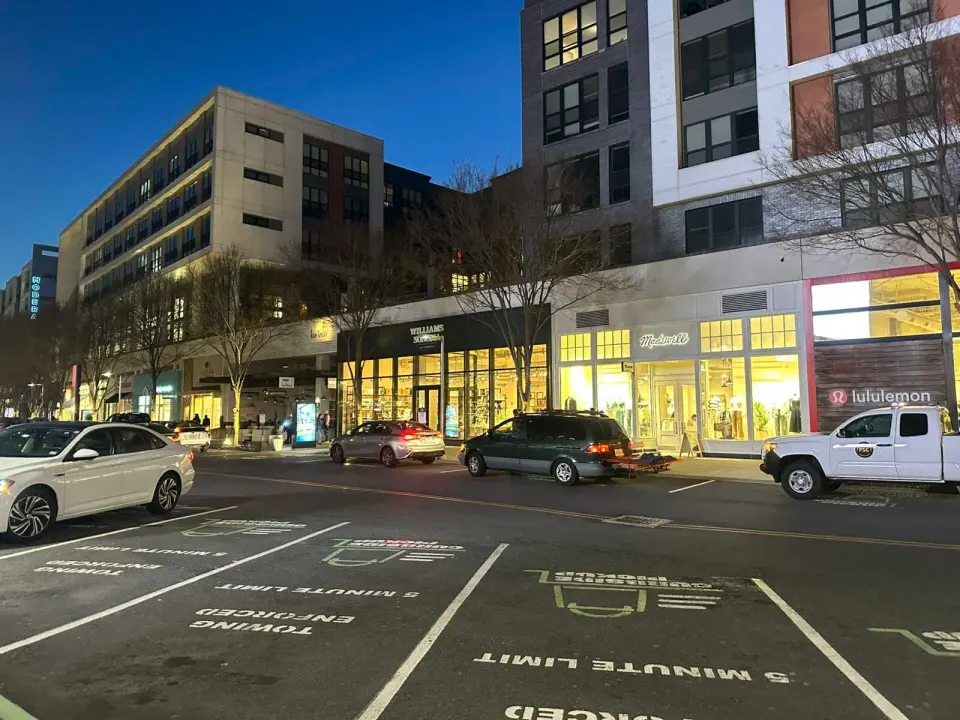 Parking spaces designated for 5-minute pickups at the Mosaic District (staff photo by Angela Woolsey)