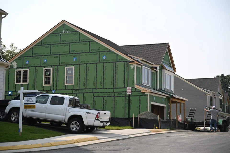 home under construction with truck parked in front of it to the left