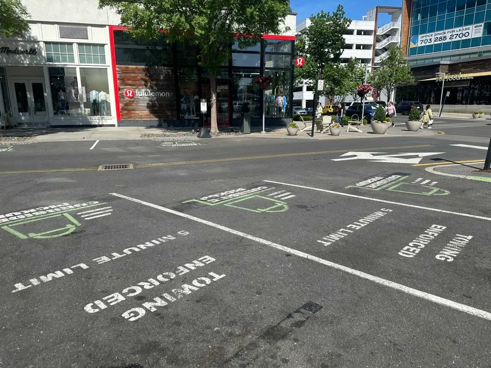 Designated curbside pickup parking spaces at the Mosaic District in Merrifield (staff photo by Angela Woolsey)