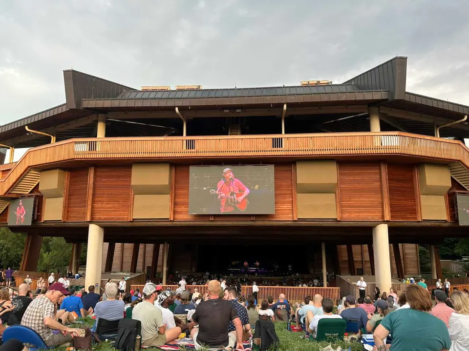 Concertgoers on the lawn at Wolf Trap National Park for the Performing Arts’ Filene Center (staff photo by Angela Woolsey)