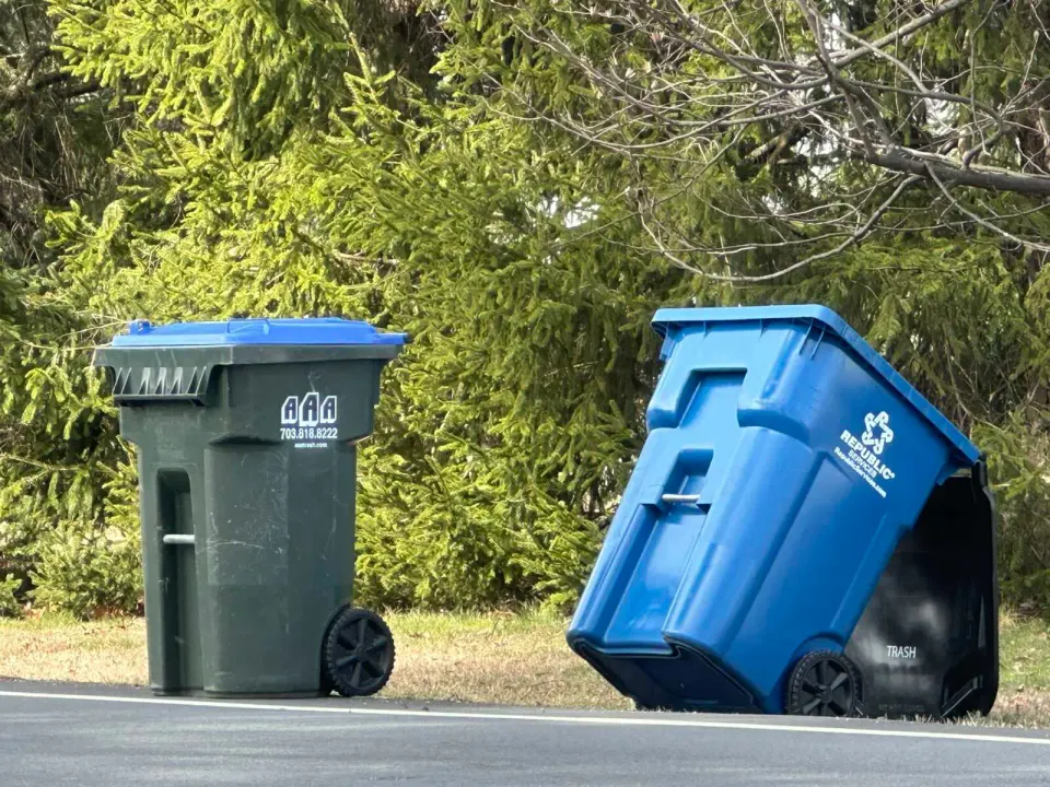 Trash bins on the side of a road in Dunn Loring (staff photo by Angela Woolsey)
