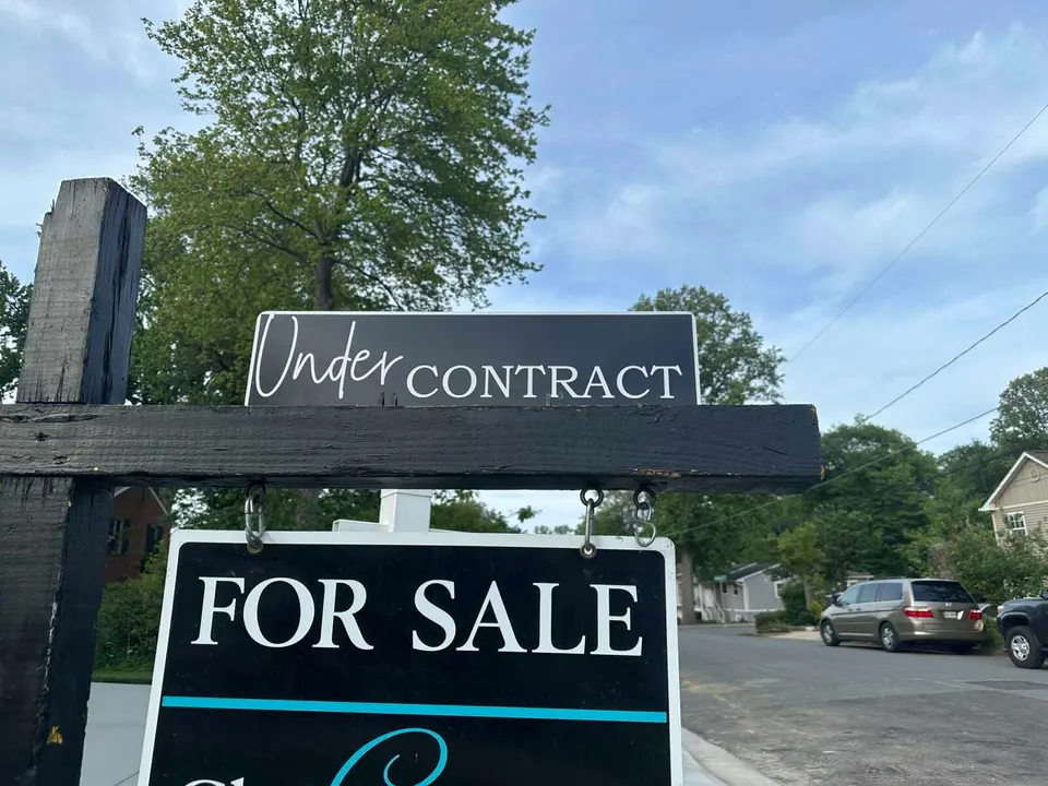 A real estate sign announces that a house for sale in Vienna is under contract (file photo)