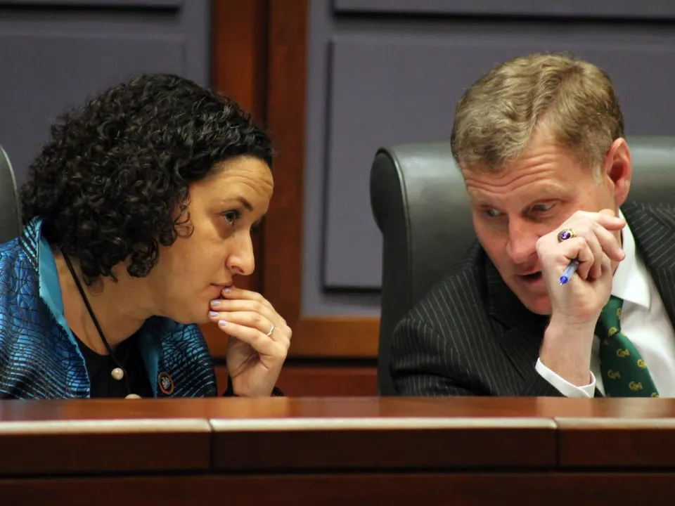 Providence District Supervisor Dalia Palchik and Board of Supervisors Chairman Jeff McKay chat during a March 2026 board meeting (staff photo by Jared Serre)
