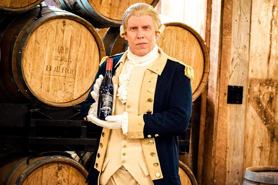 George Washington reenactor holds a bottle of The Winery at Bull Run’s commemorative Independence wine (courtesy The Winery at Bull Run/U2C by Rebecca Hagy)