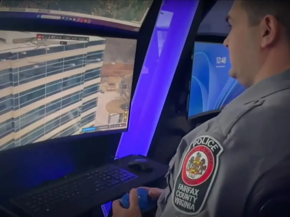 A Fairfax Police officer pilots a drone (photo via FCPD)