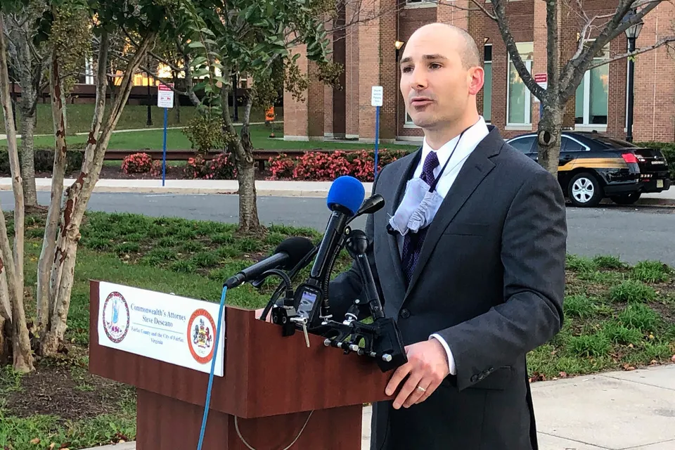 official speaks at podium