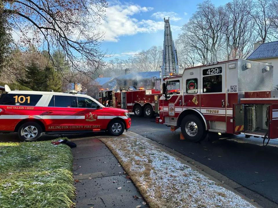 Fairfax County and Arlington fire department vehicles on the scene of a two-alarm house fire on Ridgeview Circle (staff photo)