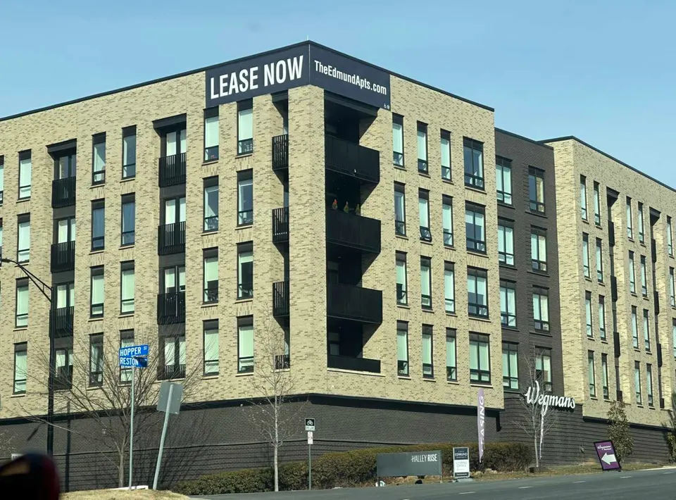 Lease now sign for the Edmund Apartments at Halley Rise in Reston in winter (staff photo by Angela Woolsey)