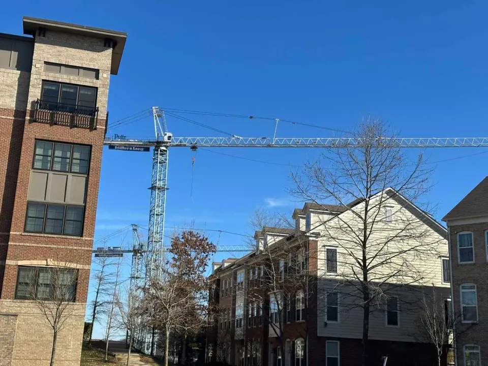 Construction cranes in Oakton’s MetroWest neighborhood (staff photo by Angela Woolsey)