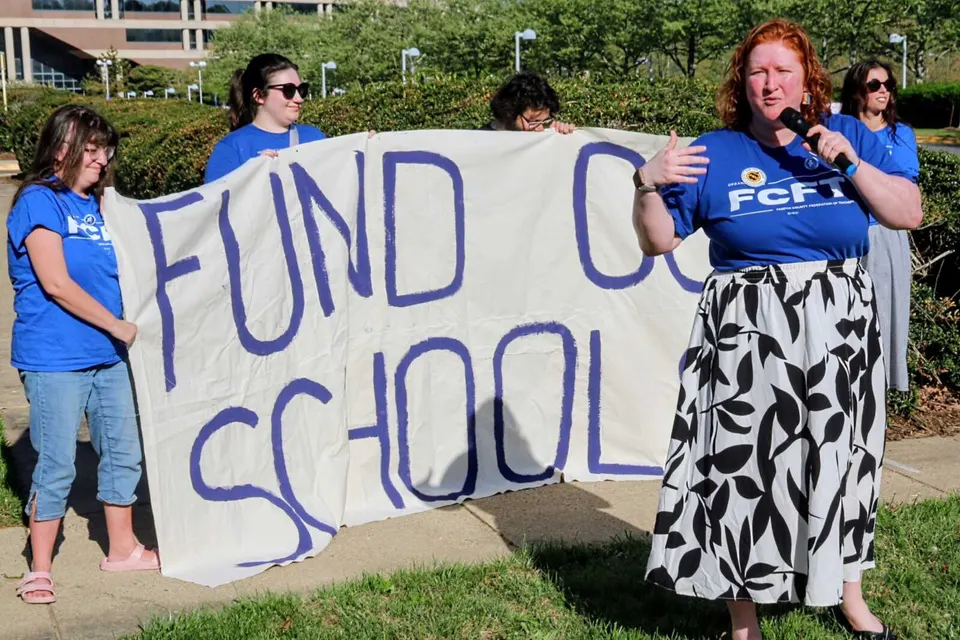 Fairfax County Federation of Teachers president Emily VanDerhoff speaks at rally (staff photo by Scott McCaffrey)