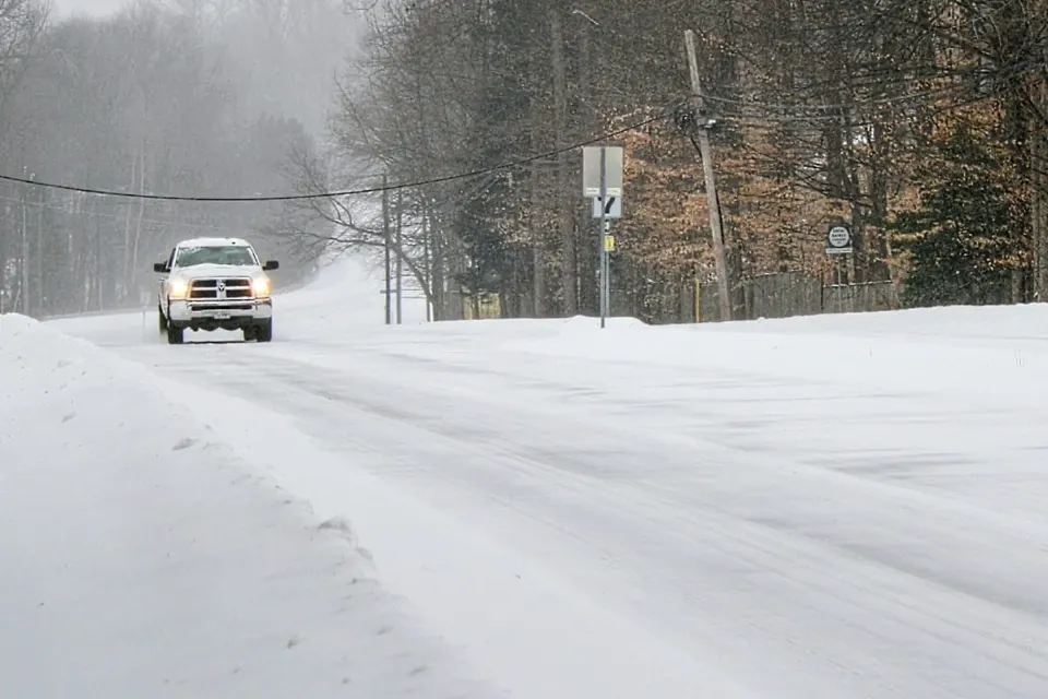 A solitary truck travels along Burke Center Parkway on Jan. 25, 2026 during Winter Storm Fern (staff photo by Dave Facinoli)