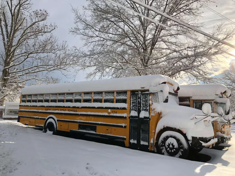 A Fairfax County Public School bus in snow (staff photo by Angela Woolsey)