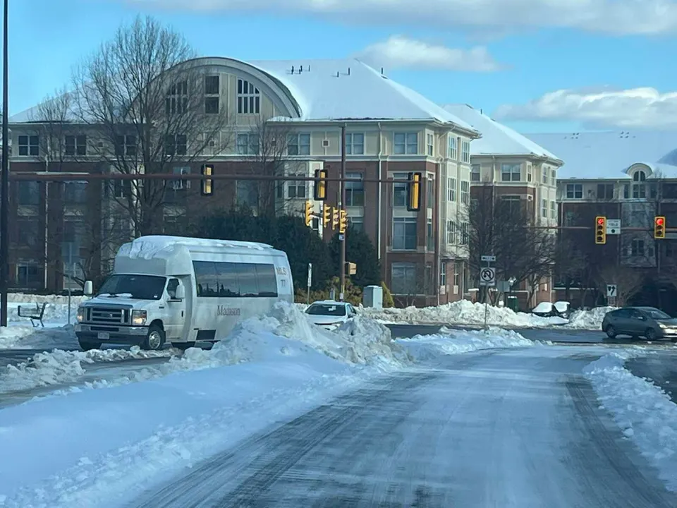 A layer of snow and ice covers Bluemont Way in Reston after Winter Storm Fern on Jan. 26, 2026 (staff photo by Angela Woolsey)