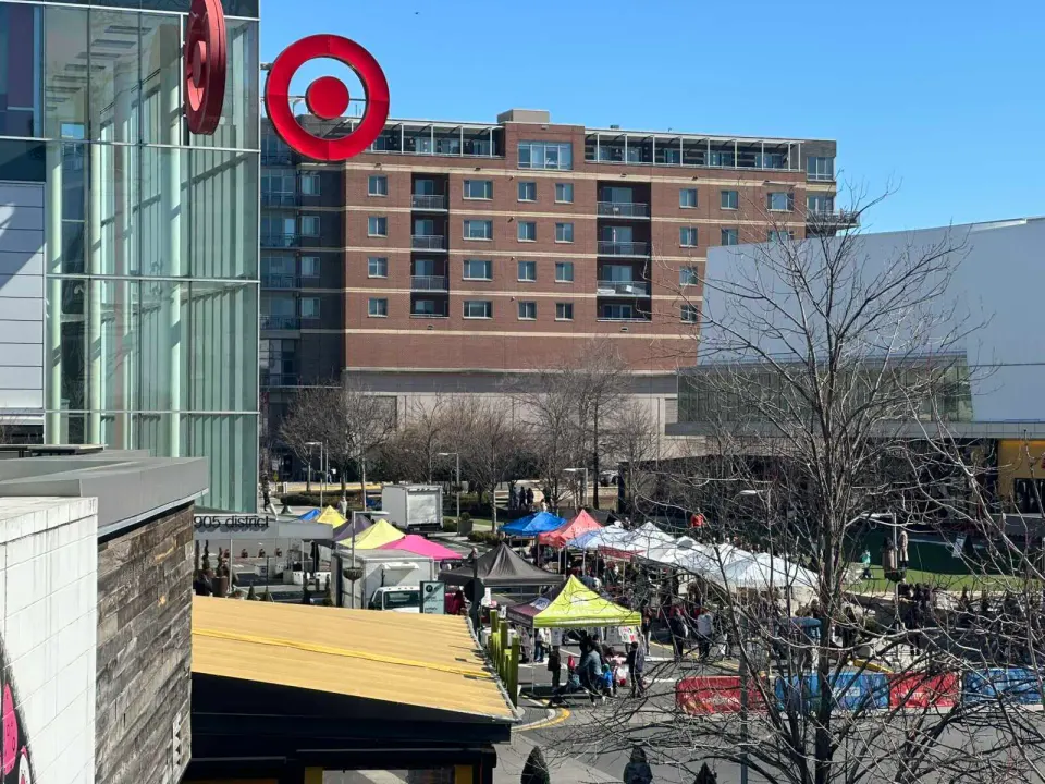 Farmers market tents beneath the Target sign at the Mosaic District (staff photo by Angela Woolsey)