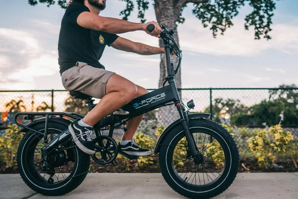 Individual riding e-bike (via G-Force Bike/Unsplash)