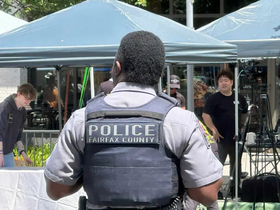 A Fairfax County police officer at the Mosaic District in Merrifield (staff photo by Angela Woolsey)