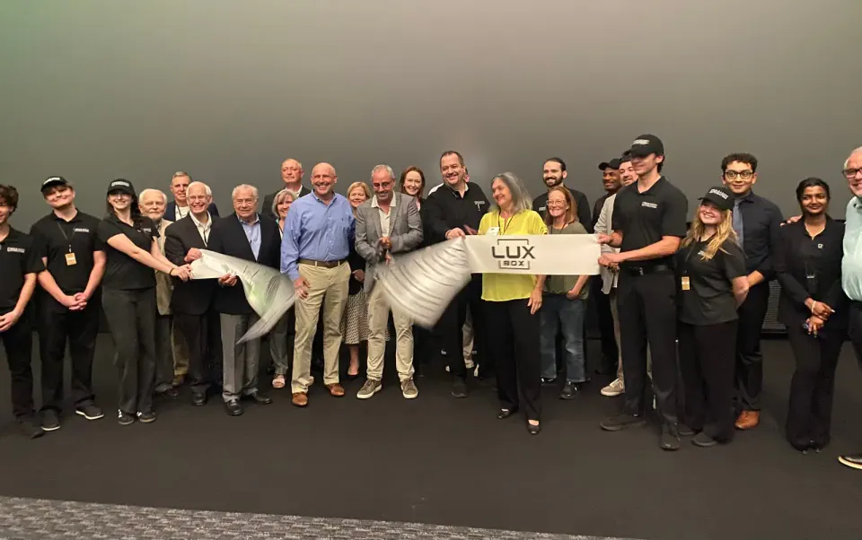 At long last.... "a joyous ribbon-cutting ceremony was held the evening of June 26 inside one of Paragon Founders Row’s Axis15 Extreme auditoriums..." Photo by Chris Jones.