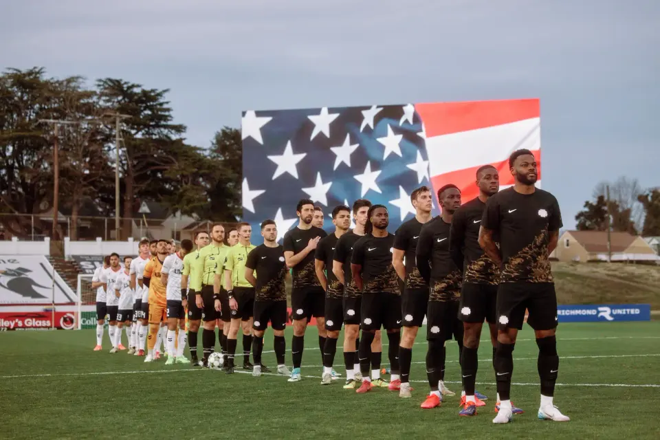Falls Church's Virginia Dream FC (wearing black) is offering furloughed federal employees free tickets to this Sunday's match at Meridian High School. Photo by Jared Soares.