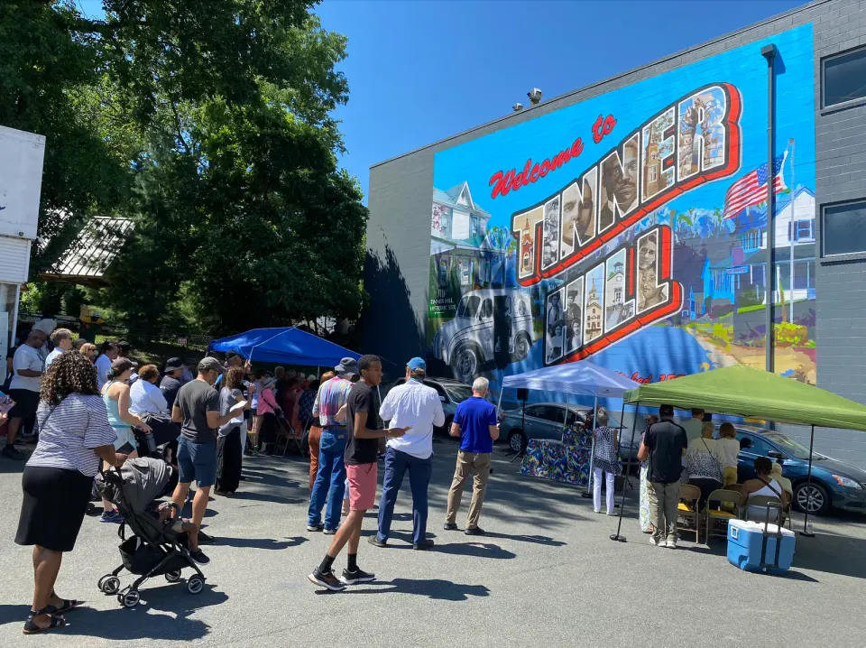June 2024 dedication ceremony for the unveiling of the Tinner Hill Mural on S. Washington Street. Photo by Chris Jones.