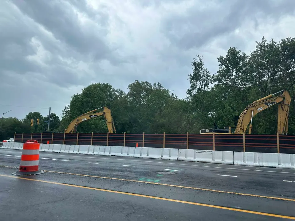 Construction vehicles behind a barrier on Nutley Street for an ongoing culvert replacement project (staff photo by Angela Woolsey)
