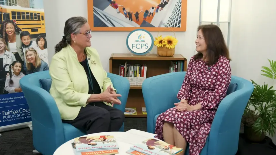Dr. Reid with Hahn Bu on the set of Our Voices, Our Future