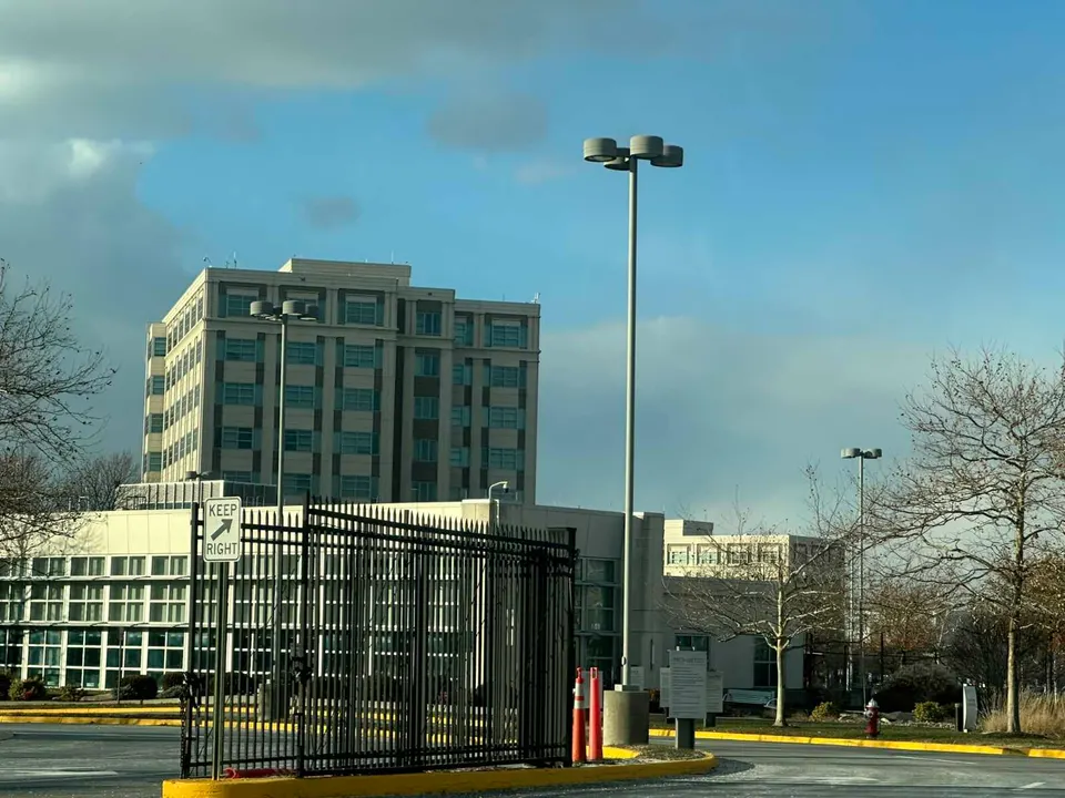 An open gate to the Dulles Discovery office complex in Chantilly (staff photo by Angela Woolsey)