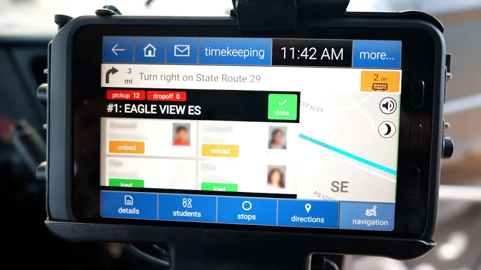 The display of a school bus tablet system showing navigation and student riders