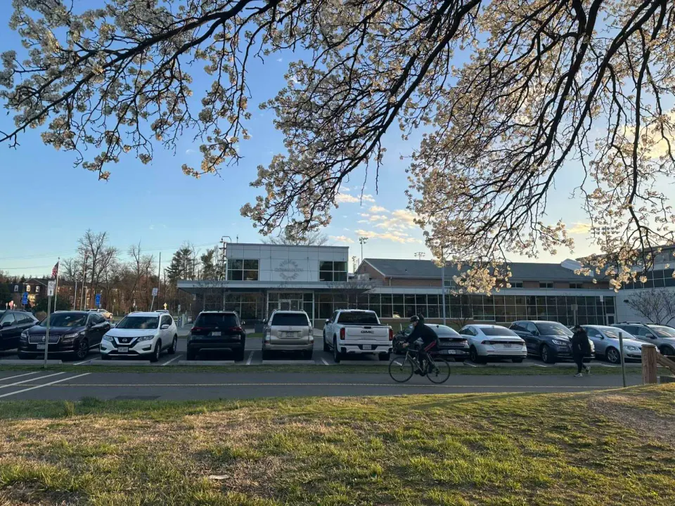 A bicyclist passes the Vienna Community Center on the Washington & Old Dominion Trail (staff photo by Angela Woolsey)