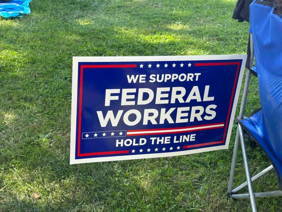 A yard sign in Vienna expressing support for federal workers (staff photo by Angela Woolsey)