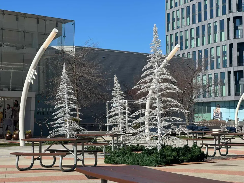Fake, winter-themed trees stand on the Plaza at Tysons Corner Center (staff photo by Angela Woolsey)