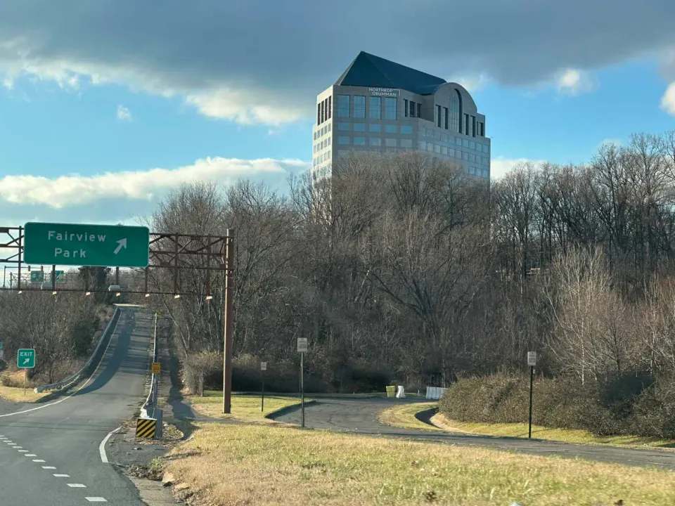 Northrop Grumman’s headquarters building in West Falls Church near a ramp to Fairview Park (staff photo by Angela Woolsey)