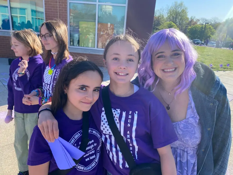 The FCPS community posing for a picture on Purple Up! Day