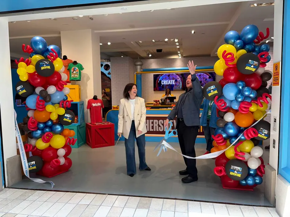 Original X Productions CEO Stacy Moscatelli helps cut the ribbon on the Hershey Super Sweet Adventure (staff photo by Katie Taranto)