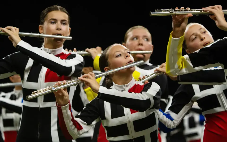 "The Avon Marching Black and Gold performs Saturday, Nov. 9, 2024, during the 51st Indiana State School Music Association marching band state finals at Lucas Oil Stadium in...