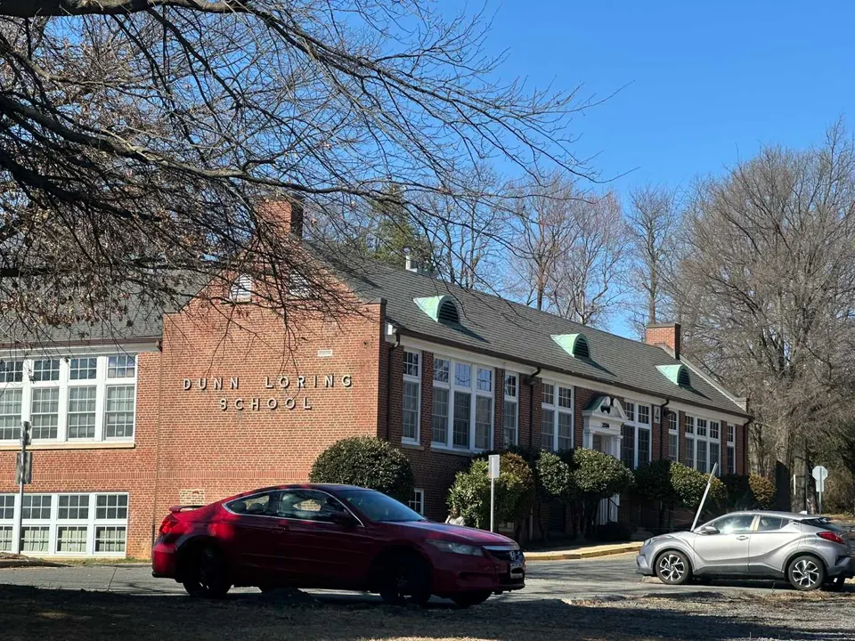 A car parked outside the Dunn Loring Administrative Center, formerly a school building (staff photo by Angela Woolsey)