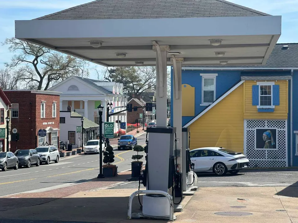 A replica of the painting “Girl with a Pearl Earring” near a gas station in Old Town Fairfax (staff photo by Angela Woolsey)