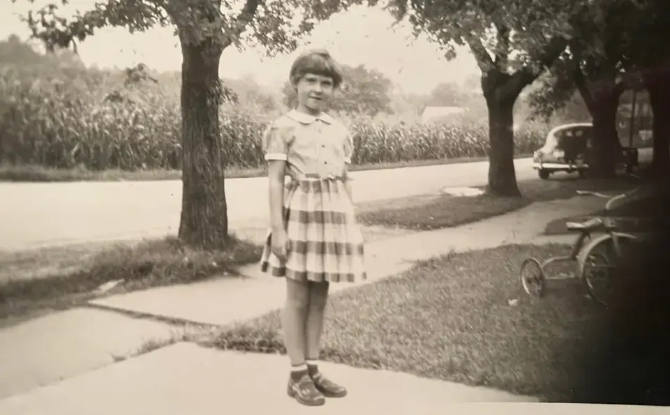 "No wonder I’m smiling so happily in this photo taken on my first day of First Grade...." Courtesy Carol McEwen.