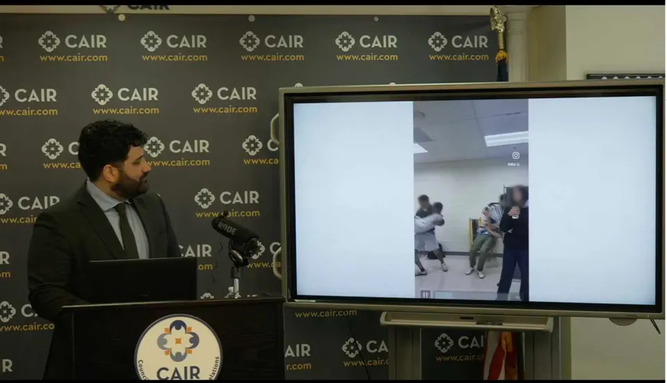 Ahmad Kaki, a staff attorney with CAIR, plays the video made by Thomas Jefferson High School students during a press conference June 4. (Screenshot via CAIR’s Facebook page)