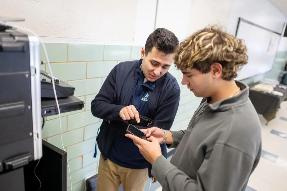 Department of Information Technology members set up audio visual equipment
