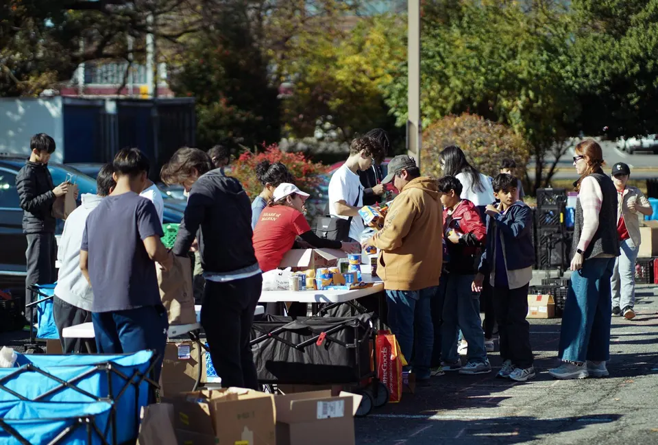 TeensForFoodBanks members sort and organize donated canned goods into care boxes during the Scouting America Drive on Nov. 8. The club gathered almost three trucks full of...