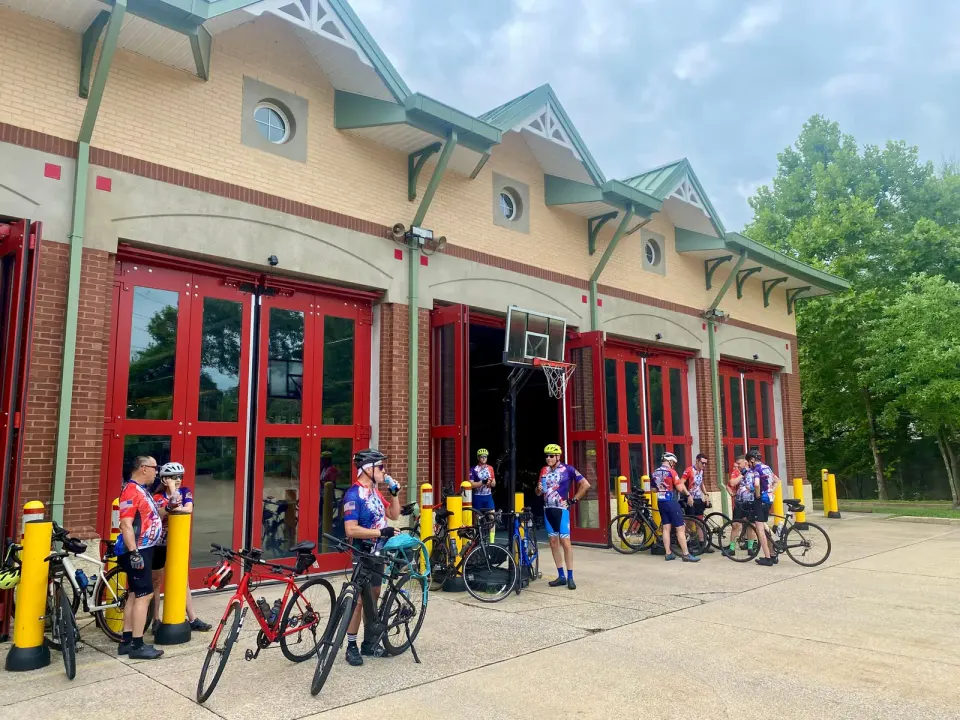 Honoring fallen EMS workers with a 62-mile ride. National EMS Memorial Bike Ride cyclists enjoy cooling off and re-hydrating at the Falls Church Volunteer Fire Department, 6,...